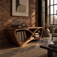 Infinity shaped record console with open bays and a smooth sculpted body in an industrial loft living room with exposed brick