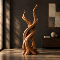 Interlaced branch sculpture with flame shaped tips and an open hollow near the base, three-quarter view showing the grain