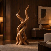 Interlaced branch sculpture with flame shaped tips and an open hollow near the base in an evening living room with walnut wall paneling