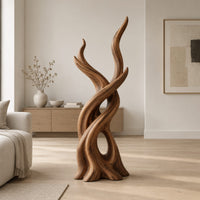 Interlaced branch sculpture with flame shaped tips and an open hollow near the base in a Scandinavian living room with white walls