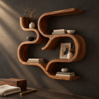 Corner detail of interlocking looped ribbon wall shelves with open pockets beside wood, brass and linen samples