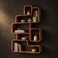 Interlocking open cubby shelf unit with staggered boxes and smooth edges in a dark studio against a charcoal plaster wall
