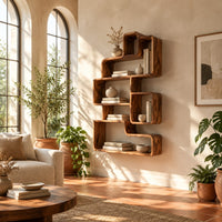Interlocking open cubby shelf unit with staggered boxes and smooth edges in a bright living room with arched windows and plants