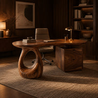Kidney shaped desk with a loop pedestal and a two drawer cabinet in an evening home office with walnut wall paneling
