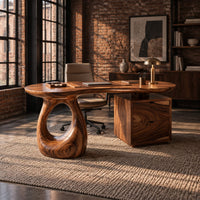 Kidney shaped desk with a loop pedestal and a two drawer cabinet in an industrial loft home office with exposed brick