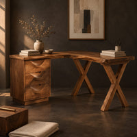 Corner detail of l shaped desk with a three drawer pedestal and crossed x legs beside wood, brass and linen samples