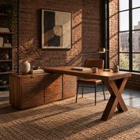 L shaped desk with an x leg and a cabinet with carved ripple fronts in an industrial loft home office with exposed brick
