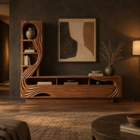Tv stand with a tall arched shelf tower and flowing carved lines in a dark living room at golden hour