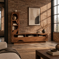 Tv stand with a tall arched shelf tower and flowing carved lines in an industrial loft living room with exposed brick