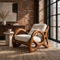 Lounge chair with large loop openings in the arms and sculpted legs in an industrial loft living room with exposed brick