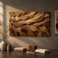 Detail of rectangular wall art panel of layered carved leaves in deep relief beside wood, brass and linen samples