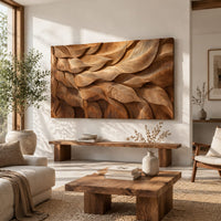 Rectangular wall art panel of layered carved leaves in deep relief in a bright sunroom with green plants