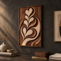 Detail of framed wall art carved with heart shaped leaves in layered relief beside wood, brass and linen samples