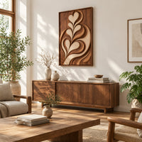 Framed wall art carved with heart shaped leaves in layered relief in a bright sunroom with green plants