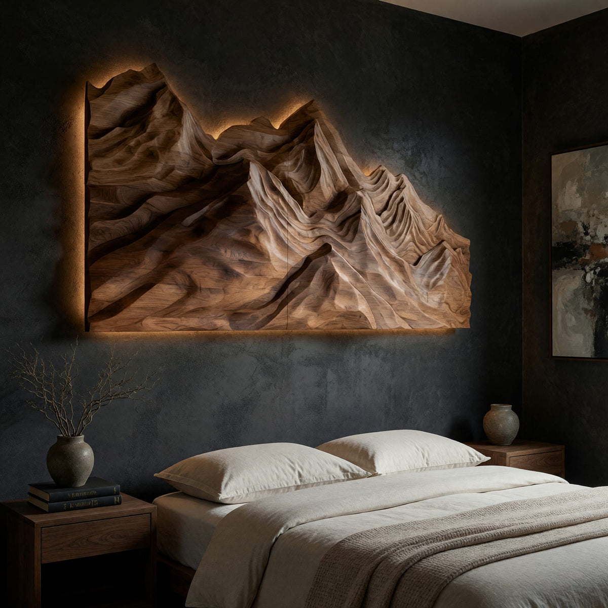 Layered ridge carved mountain wall art on a dark charcoal plaster wall