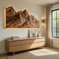Layered ridge carved mountain wall art above a light oak sideboard in daylight