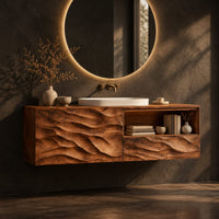 Floating vanity with layered carved ridges and an open shelf on the right, three-quarter view showing the grain