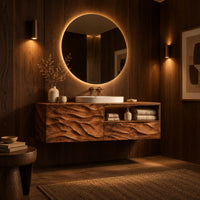 Floating vanity with layered carved ridges and an open shelf on the right in an evening bathroom with walnut wall paneling