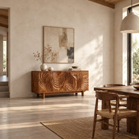 Sideboard with four layered swirl carved panels on sturdy legs in a bright open plan dining room