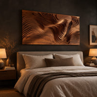 Wide wooden wall art panel with layered carved wave ridges above a bed in a dusk lit bedroom