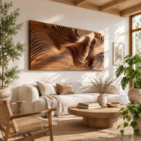 Wide wooden wall art panel with layered carved wave ridges in a bright sunroom with green plants