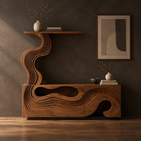 Corner detail of tv stand with wave carved panels and a rising column holding a shelf beside wood, brass and linen samples