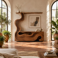 Tv stand with wave carved panels and a rising column holding a shelf in a bright living room with arched windows and plants