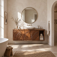 Leaf carved bathroom vanity cabinet with three panels and an open cubby in a bright open plan bathroom