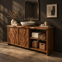 Bathroom vanity with leaf carved doors and an open shelf bay beside them, three-quarter view showing the grain
