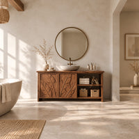 Bathroom vanity with leaf carved doors and an open shelf bay beside them in a bright open plan bathroom