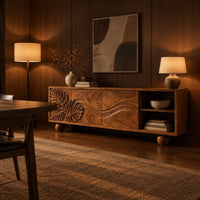Sideboard with leaf carved doors, ball feet and an open shelf bay in an evening dining room with walnut wall paneling