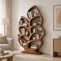 Leaf shaped bookshelf with branching veins forming oval shelves in a Scandinavian living room with white walls