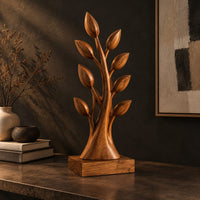 Tree shaped wood sculpture with leaf tips and a flared trunk, three-quarter view showing the grain