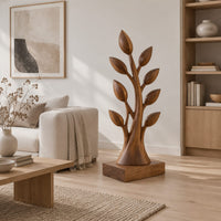 Tree shaped wood sculpture with leaf tips and a flared trunk in a Scandinavian living room with white walls