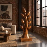Tree shaped wood sculpture with leaf tips and a flared trunk in an industrial loft living room with exposed brick
