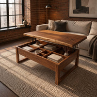 Wooden lift top coffee table with divided compartments and square frame legs in an industrial loft living room with exposed brick