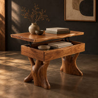 Lift top coffee table with a natural edge top and two trunk shaped legs, three-quarter view showing the grain