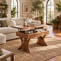 Lift top coffee table with a natural edge top and two trunk shaped legs in a bright living room with arched windows and plants