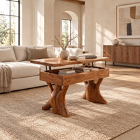 Lift top coffee table with a natural edge top and two trunk shaped legs in a bright open plan living room