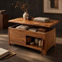 Corner detail of wood coffee table with a lifting live edge top and an open side shelf beside wood, brass and linen samples