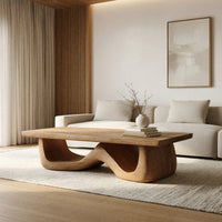 Light toned coffee table with a wave shaped base in a bright modern living room