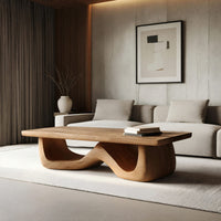 Light toned coffee table with a wave shaped base in an open plan space in daylight