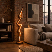 Lightning bolt floor lamp with angular faceted sides and a glowing seam in an industrial loft living room with exposed brick