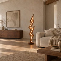 Lightning bolt floor lamp with angular faceted sides and a glowing seam in a bright open plan living room