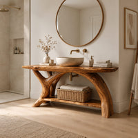 Live edge bathroom vanity on branching trunk legs with a low shelf in a Scandinavian bathroom with white walls