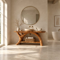 Live edge bathroom vanity on branching trunk legs with a low shelf in a bright open plan bathroom