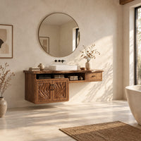 Live edge bathroom vanity cabinet with carved wave doors and a small drawer in a bright open plan bathroom