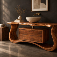 Corner detail of live edge bathroom vanity with a curved wave base and a drawer cabinet beside wood, brass and linen samples