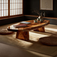 Thick live edge slab coffee table on block pedestals, three-quarter view showing the grain