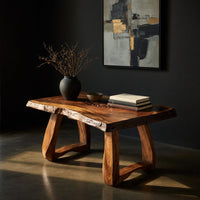 Live edge coffee table with a carved rosette inlay, three-quarter view showing the grain